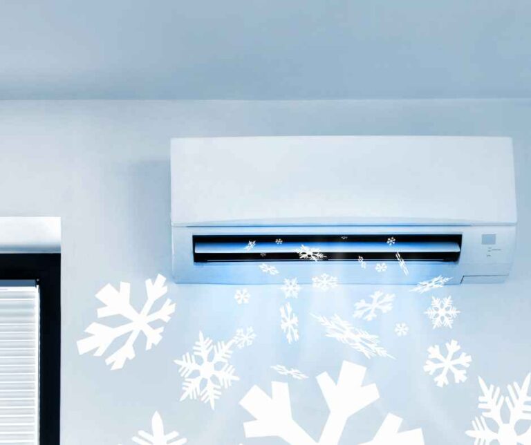 An air conditioner blowing cold air signified by added snowflakes
