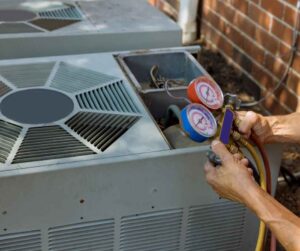 Someone working on an outside air conditioner