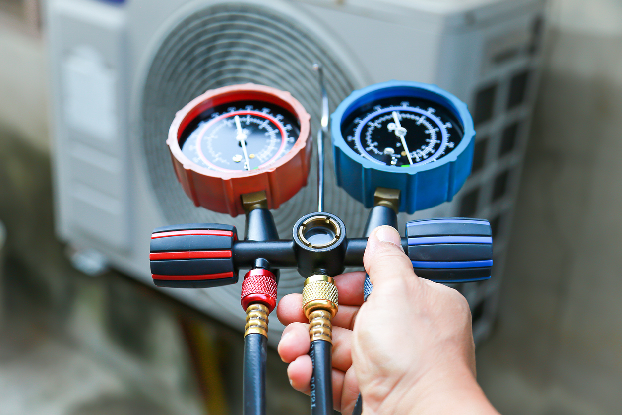 Technician Checking AC Unit