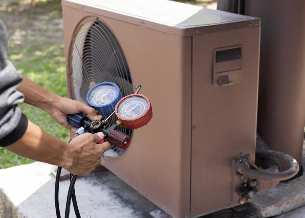 Technician Checking AC Unit